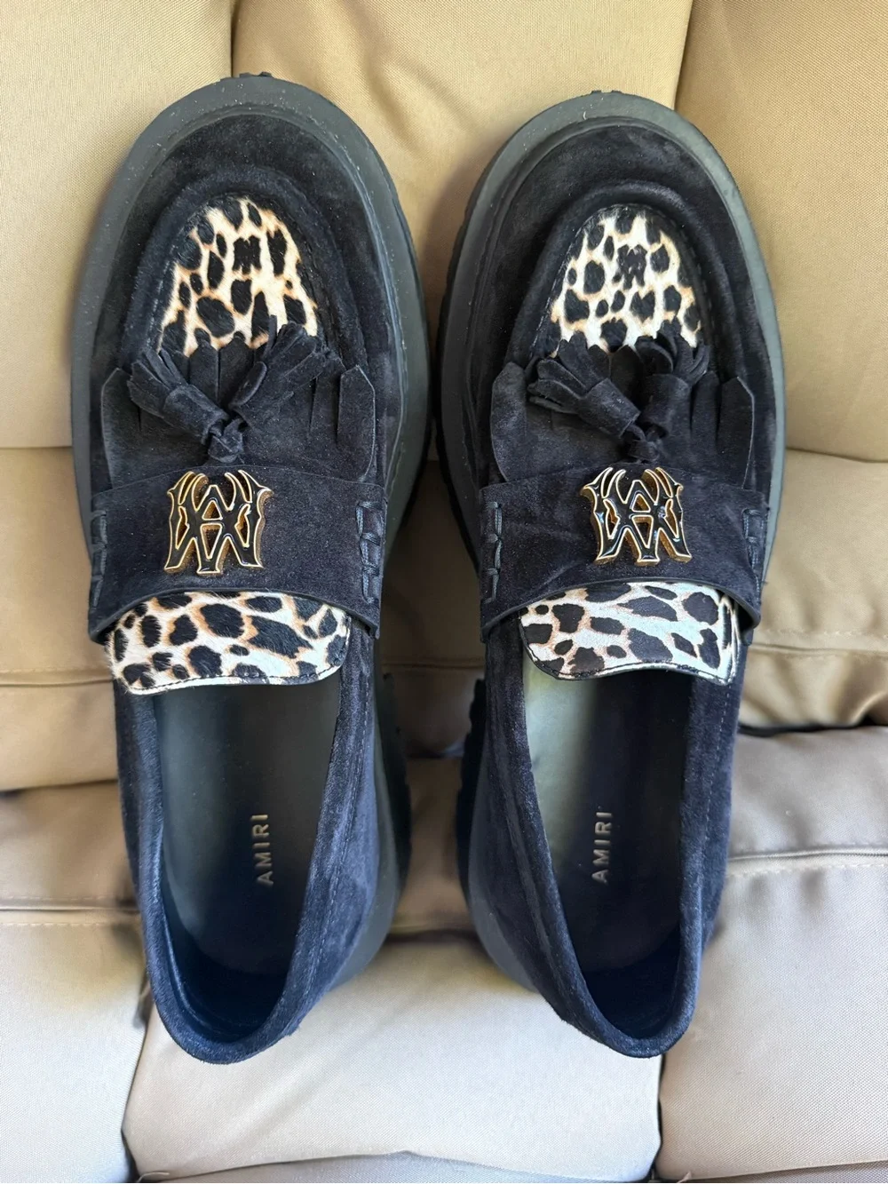 AMIRI Black Suede Tassel Loafers with Leopard Accent and Gold Crest
